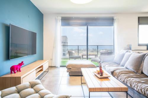 Nahariya Apartment | Vibrant Seaside Stay with Balcony by Sea N' Rent