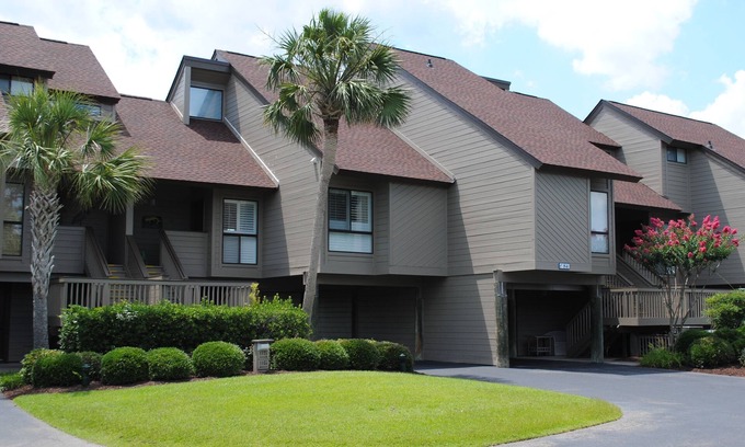 Litchfield by the Sea House | Villa with marsh views and pool access located within gated Litchfield By the Sea community.