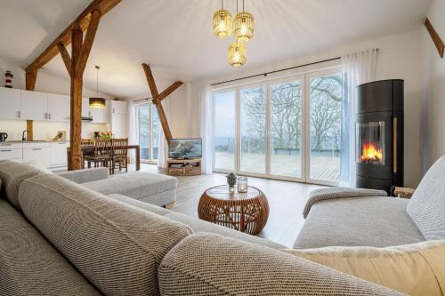 Steinbergkirche Apartment | Westscheune am Mühlendamm - Meerblick, Sauna und Ofen