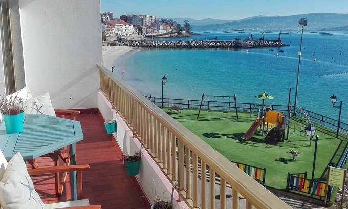 Raxo Apartment | Wonderful sea view! In front of the beach. 5 km from Sanxenxo. Free WIFI