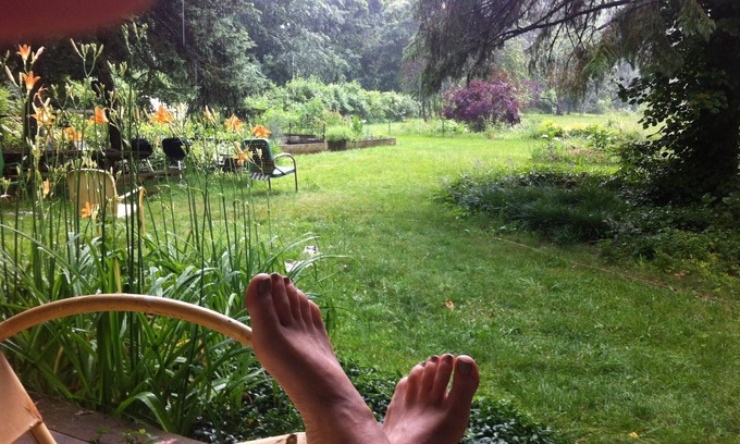 Three Oaks House | You're in a hot tub; you see gardens and hear wind blowing through the pines.