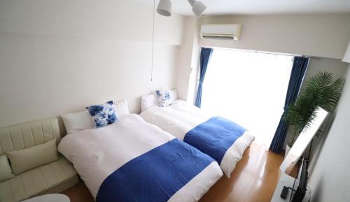 One-Bedroom Apartment with Balcony and City View