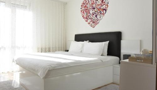 One-Bedroom Apartment with Balcony and City View