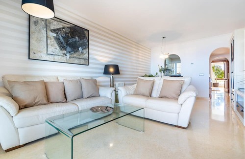 Rincon de la Victoria Apartment | Comfortable, attractively located vacation home with shared pool and panoramic sea views.