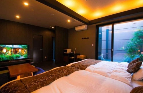 Oita House | Twin beds tatami onsen openair jacuzzi bath / Oita Ōita