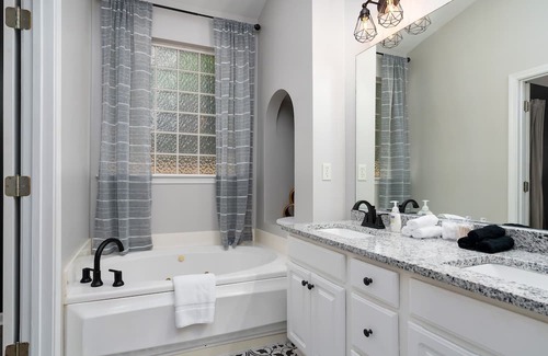 Alabaster House | Enjoy a Gardenside Getaway - Fenced Yard & Patio