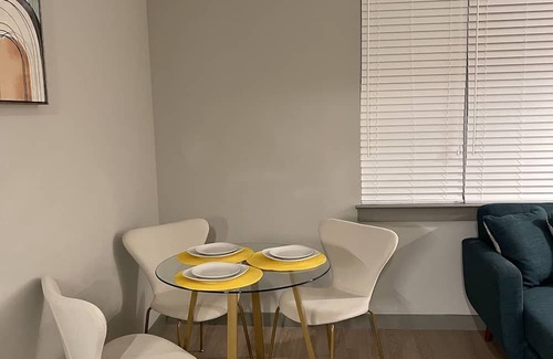 Town Center Apartment | Yellow Serenity: A perfect balance of serenity with nearby entertainment.