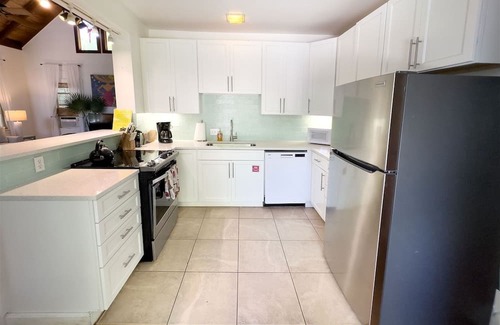 White Street Gallery District House | Amanda`s Garden Getaway 3 BR / 2 BA with shared large pool