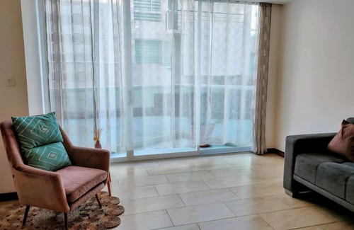 Conocoto Apartment | Minimalist suite with volcano view