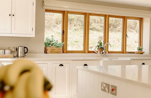 Acrefair House | A luxurious riverside cottage with stunning views, a hot tub, and fishing access.