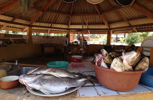 Comoe House | Round bungalow kitchenette on Lionsrest - on the West African Atlantic coast