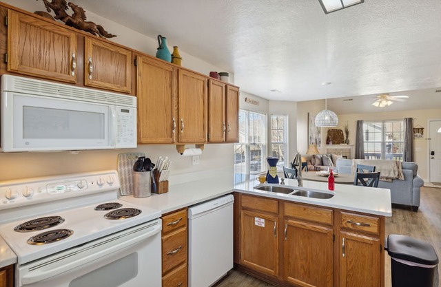 Peaceful & charming retreat with great location, large porch, fireplace, & W/D