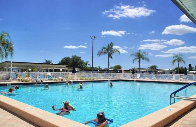 Welcome to La Casa, a vibrant 55+ gated community where comfort meets resort-style living. This fully furnished 2-bedroom, 2-bath mobile home features a bright Florida room, a dedicated office area, and tandem parking for two vehicles.