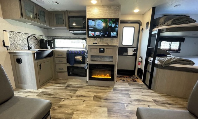 Lexington - Salisbury RV Rental | Come glamping in a Cozy 1-bedroom camper with double bunks and a sofa