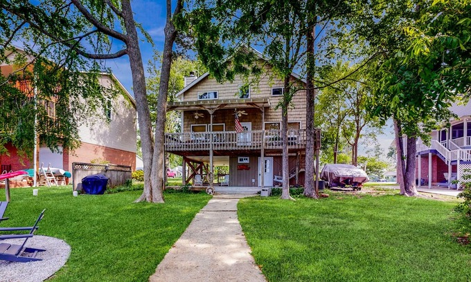 Newberry Shores House | Unique waterfront home with direct water access, dock, firepit, porch, W/D, AC