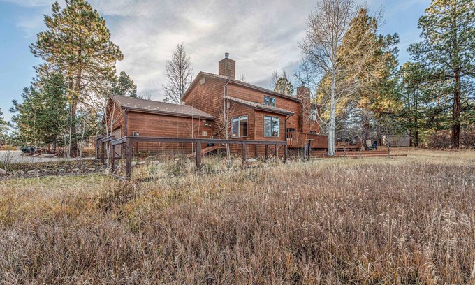 Durango West House | Nestled back from the road behind tall aspens w/ private views of open space
